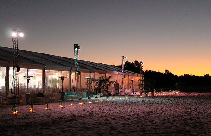 Beachside of marquee on dusk for launch of new Mazda