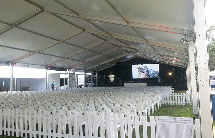 VIP seating in the foreground on vogue folding chairs with pippee chair towards the back at recent gala concert.