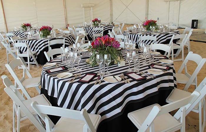 Vogue white folding chairs for corporate beach event