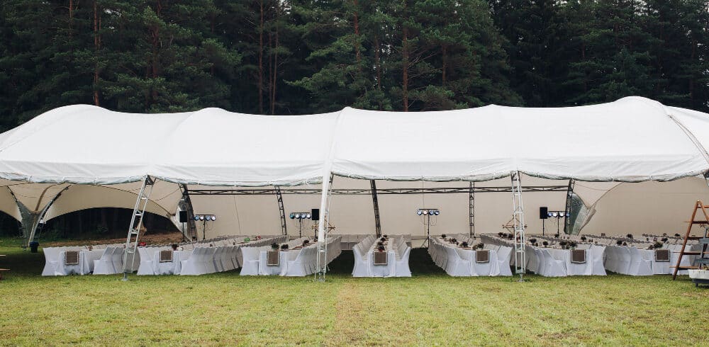 Tables with different delicious food staying in garden